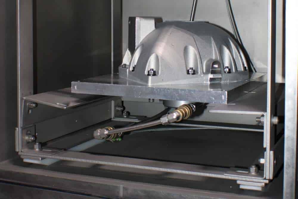 image of aluminum casting helium testing at Alcast Company aluminum foundry